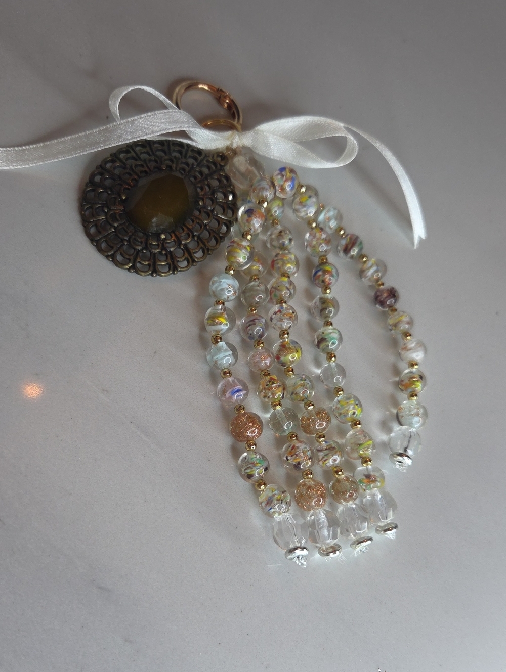 Handcrafted Multicolor Glass Bead Bag Charm with Bronze Medallion